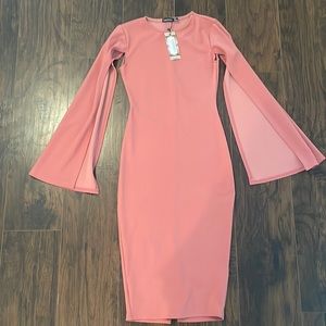Rose fitted dress with elegant long “cape” sleeves.